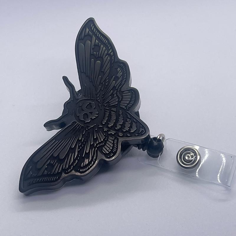 Black deadhead moth badge reel